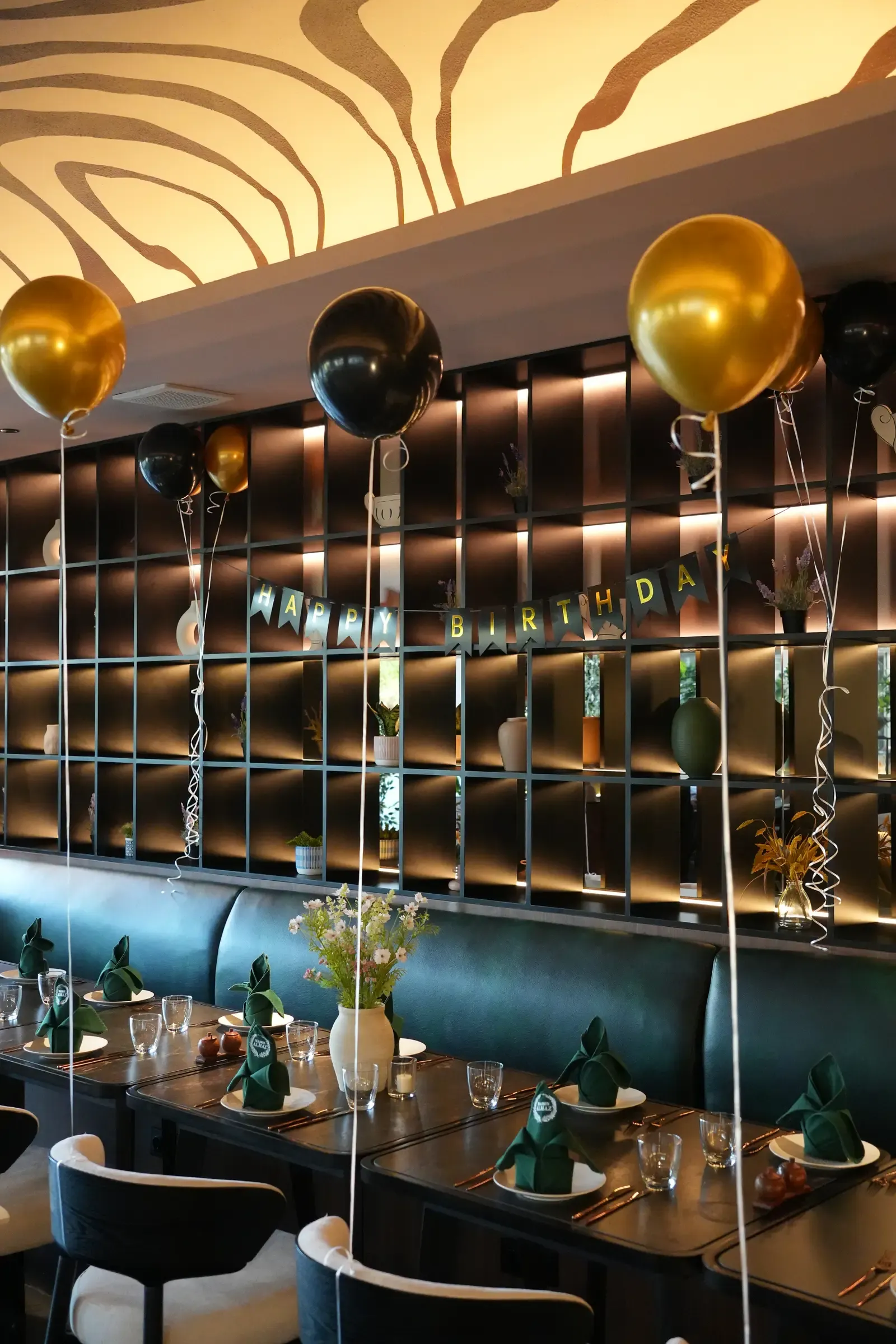 A birthday table set with balloons at Maison Almaz, Canggu