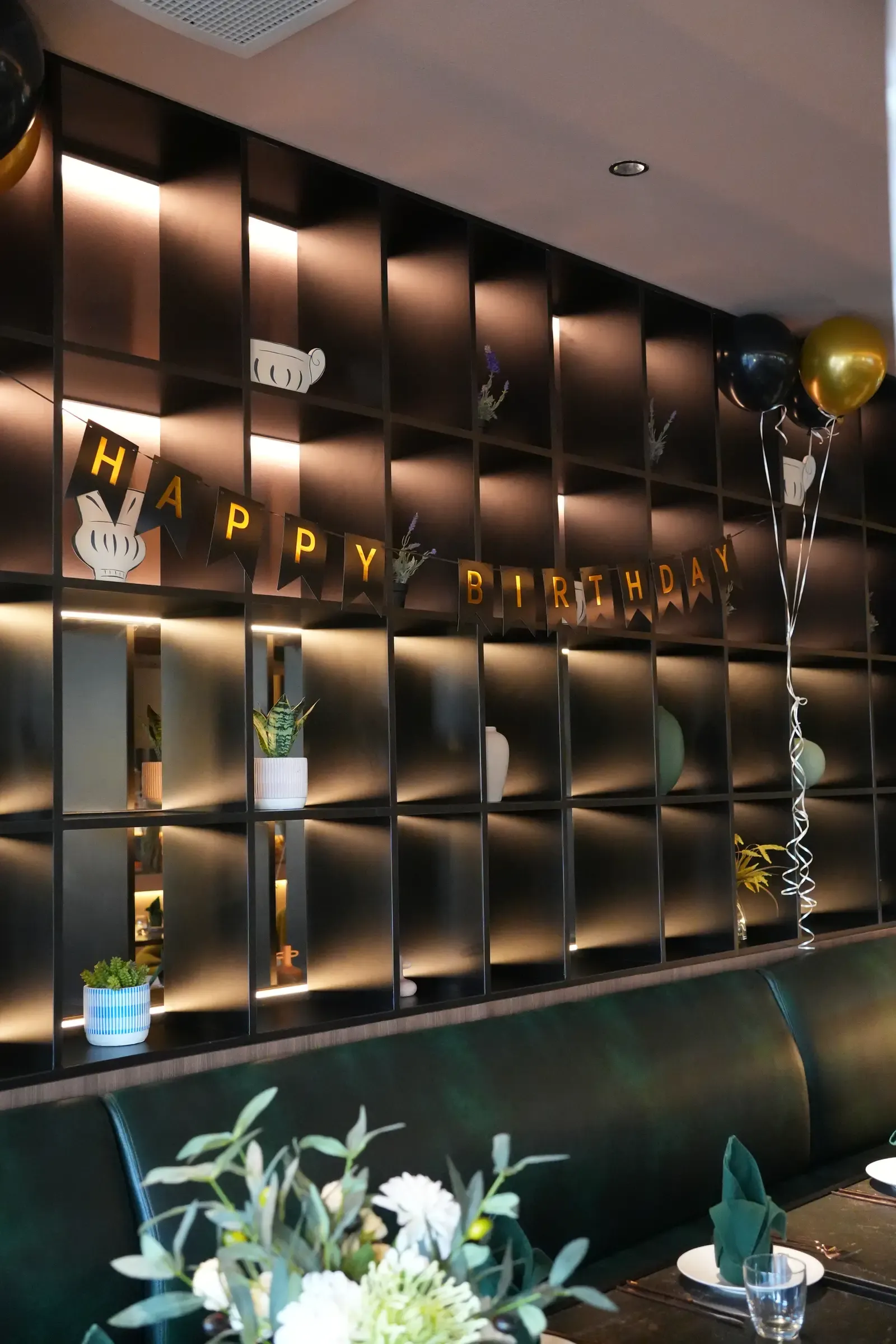 Happy Birthday balloon banner and decorated table at Maison Almaz, Canggu