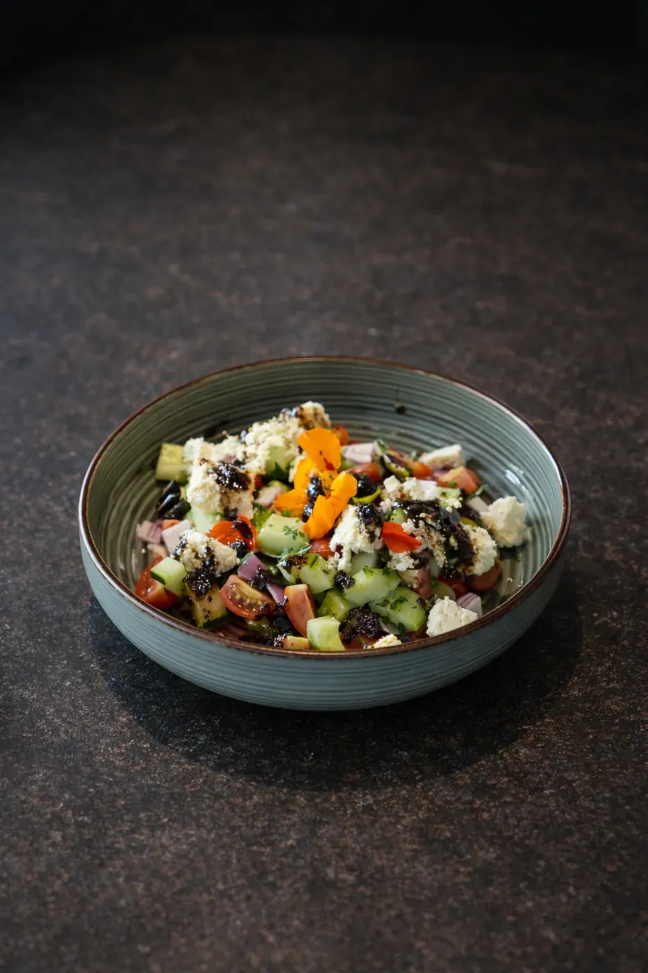 Greek salad bowl with feta cheese and olives