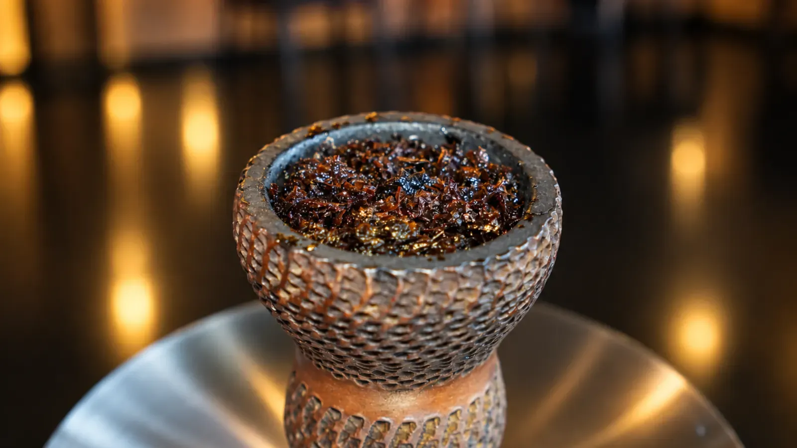 Close-up of a packed shisha bowl on the bar at Maison Almaz, Canggu