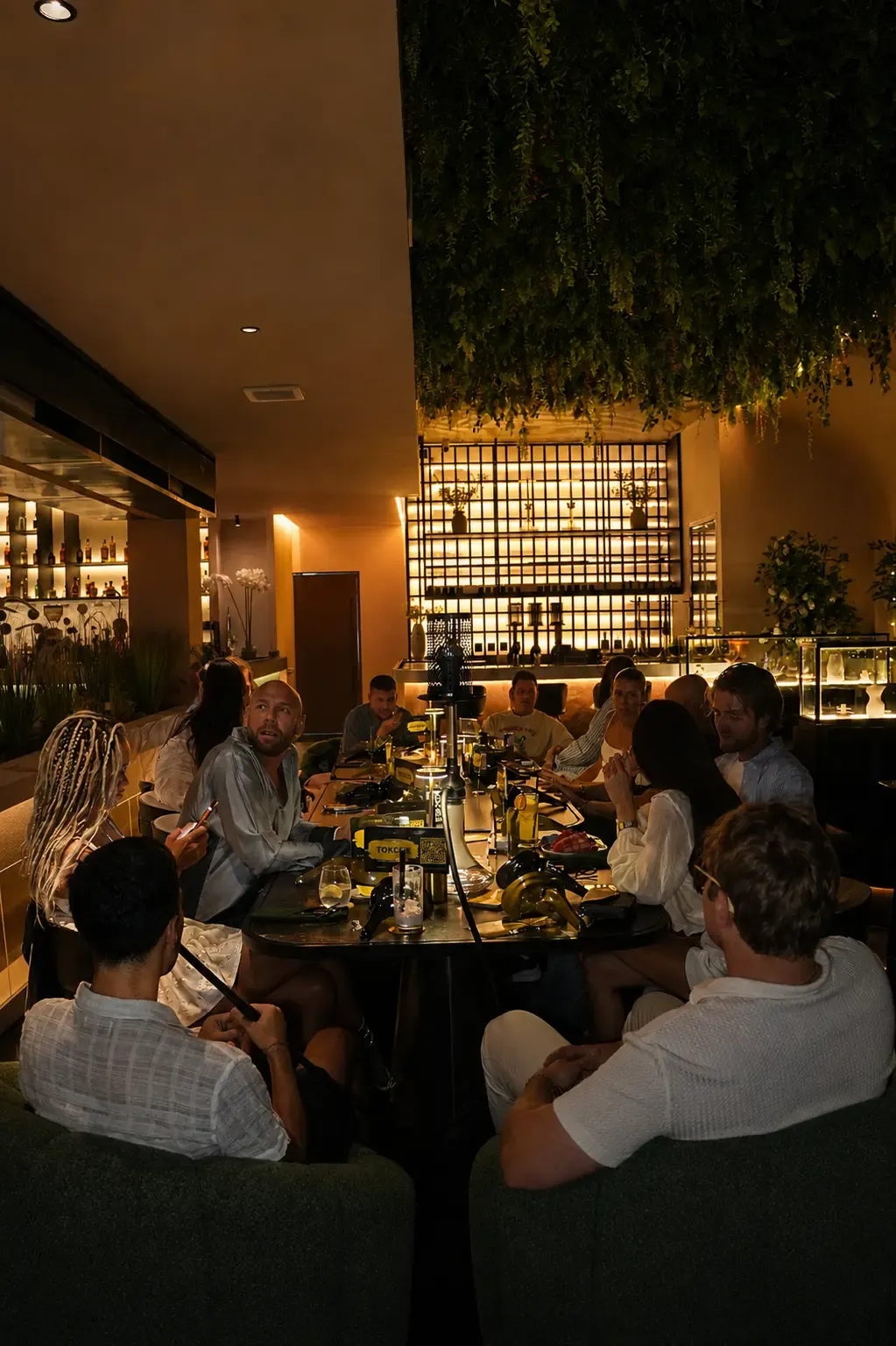 Warm, low-lit bar and dining room for a date night at Maison Almaz, Canggu