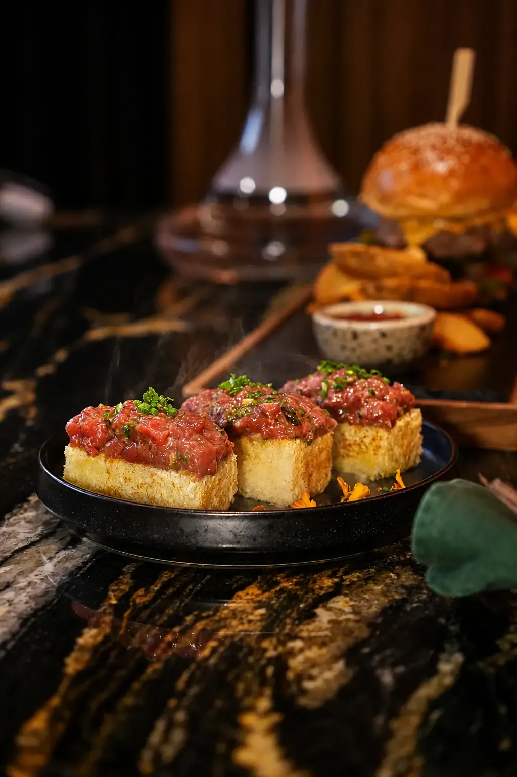 Beef tartare bruschetta plated in the Private Room at Maison Almaz, Canggu